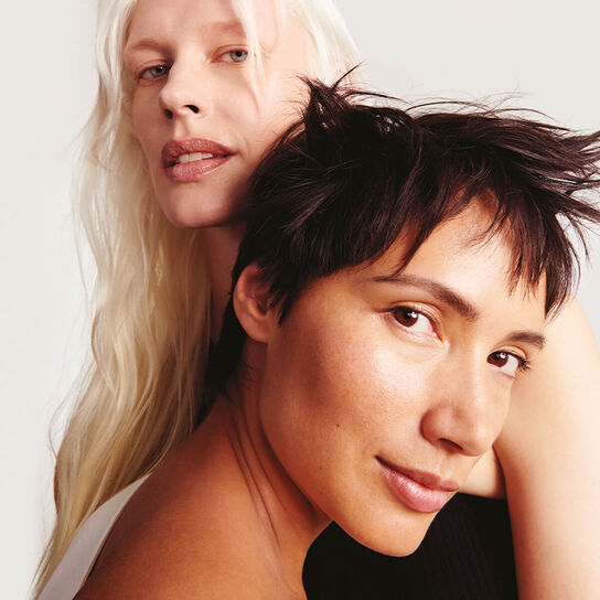 Lined up cleansers with water and foam 