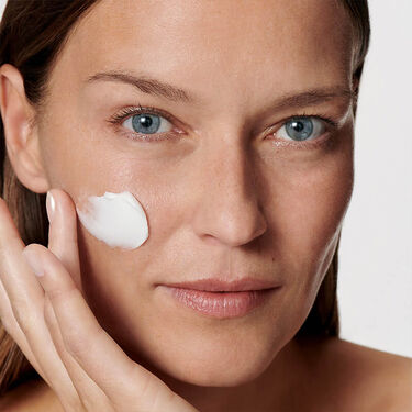 Women with cleanser on their faces 