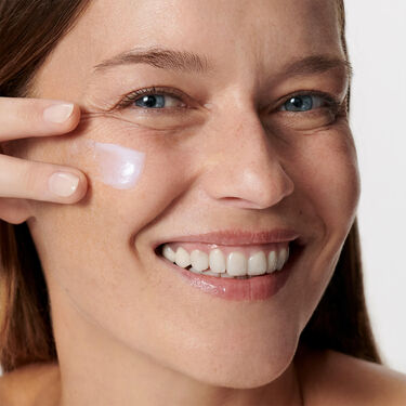 Women with cleanser on their faces 