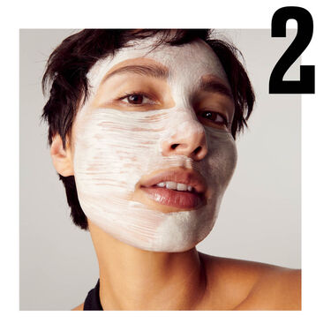 hands holding cleansers