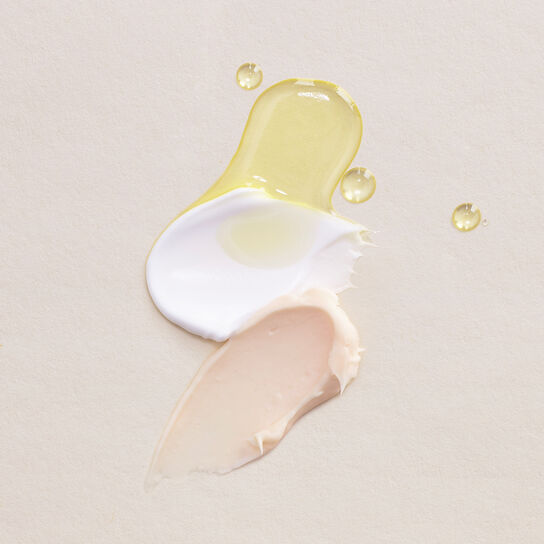 Lined up cleansers with water and foam 